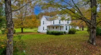 Discover this hidden homestead, a Kentucky farmhouse for sale with a picturesque retreat on 23 acres.