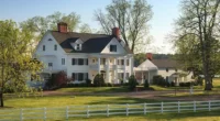 Virginia Farmhouse for Sale: Discover the Charm of Warner Hall Property's Stately Waterfront Farmland in Virginia.