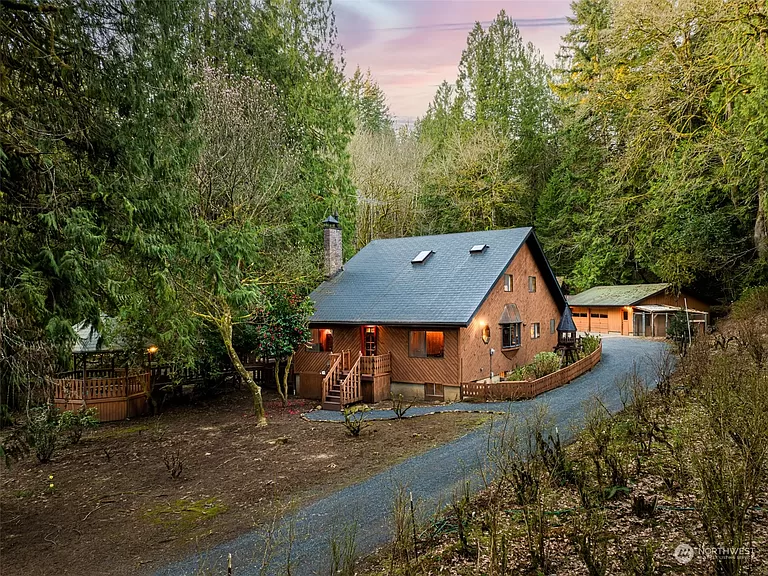 Your private Washington cabins for sale: 5-Bedroom Log Cabin with Year-Round Creek and Gourmet Kitchen.