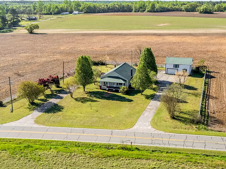 Idyllic North Carolina Farmhouse for Sale, Picturesque Countryside Retreat with Covered Porches.