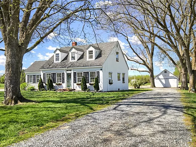 Charming Virginia homes for sale: embrace comfort and tranquility in this Cape Cod Home.