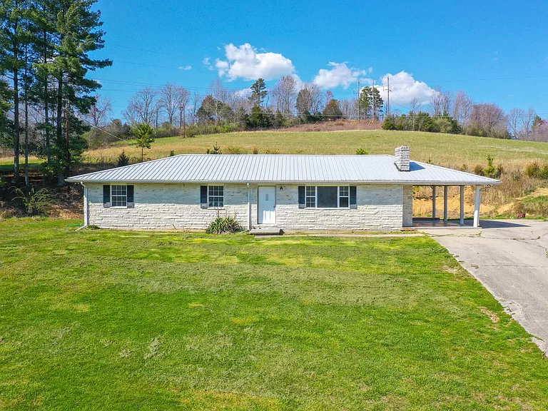 Adorable Kentucky farmhouse for sale. Discover your homestead on 37+ acres of rolling farmland.