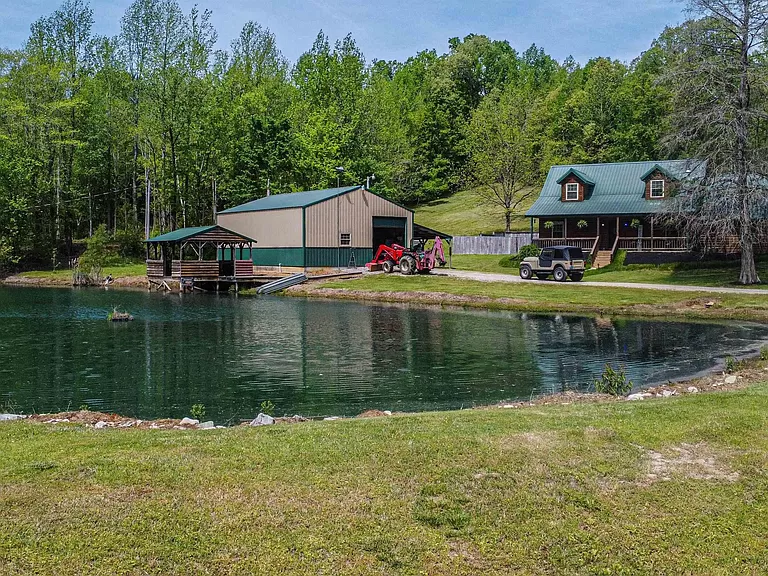 charming Kentucky cabins for sale, homestead on a 12-acre lot with a stocked pond.