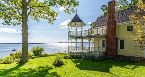 Charming Maine waterfront homes for sale: explore a Victorian cottage with stunning Maine waterfront property.