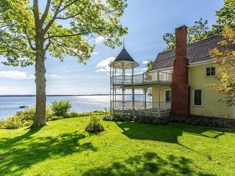 Charming Maine waterfront homes for sale: explore a Victorian cottage with stunning Maine waterfront property.