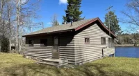 Adorable Michigan lakefront cabins for sale. Upgraded cottage on 72 acres at Gravel Lake.