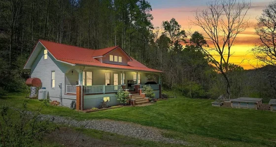 Charming North Carolina farmhouses for sale: This beautiful mountain farmhouse spans 7 acres.