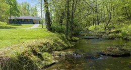 Secluded Tennessee farmhouse for sale; discover this homestead on 75 acres of farmland.
