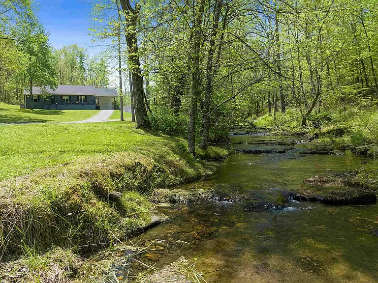 Secluded Tennessee farmhouse for sale; discover this homestead on 75 acres of farmland.