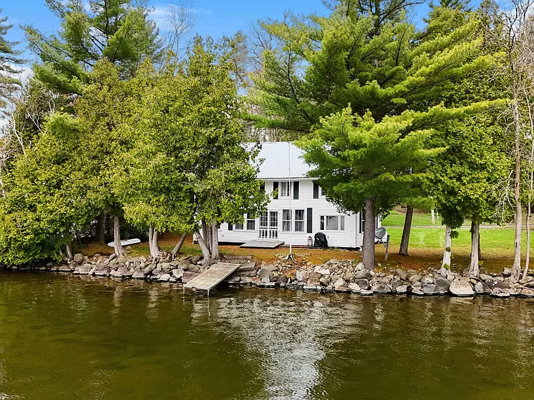 Charming Vermont lakefront cabin for sale: Your spacious summer cottage on Lake Carmi.