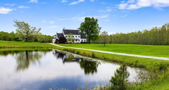 Charming Virginia farmhouse for sale. Discover this 27-acre farm with a pond and pastoral land.