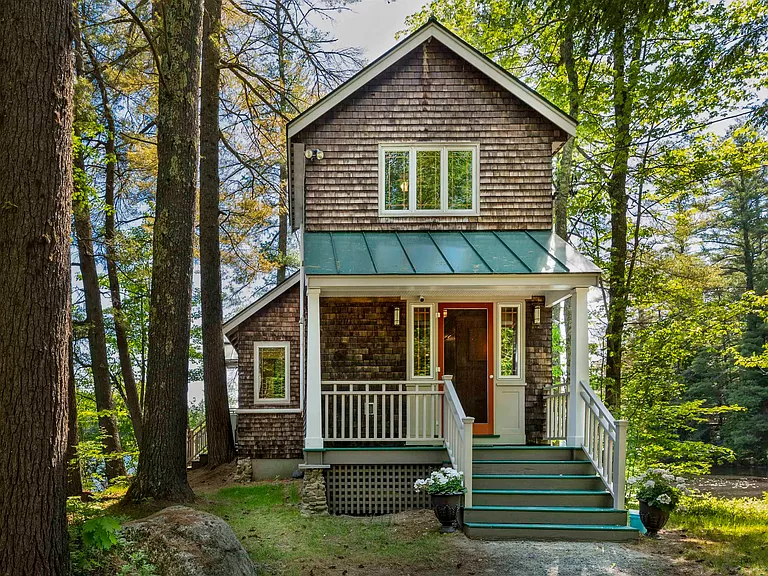 New Hampshire Waterfront Home for Sale: Explore this stunning Chase Pond Cabin Getaway.