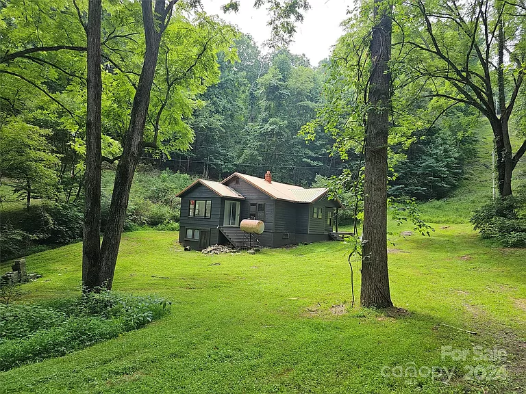 Charming North Carolina Home with Land for Sale: Finish Your Dream Home on 10 Acres.