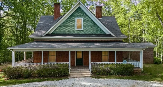 North Carolina Farmhouse for Sale: 3.34 Acres of Unrestricted Land and Unique Details.