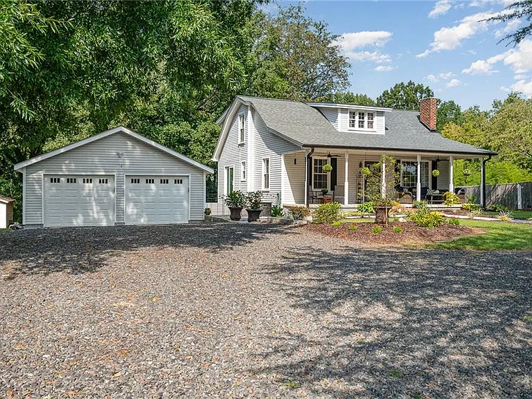 Charming North Carolina Farmhouse for Sale: Rustic Charm Meets Modern Comforts.